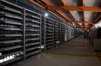A large-scale mining farm highlighted by rows of mining rigs